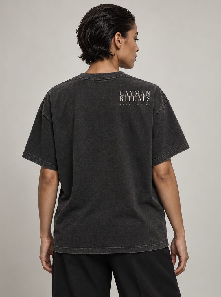 Studio render: the back of the shirt, with the Cayman Rituals signature below the collar.