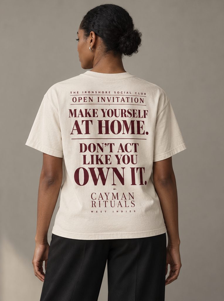 Studio render: the back of the shirt, reading Make yourself at home. Don't act like you own it.