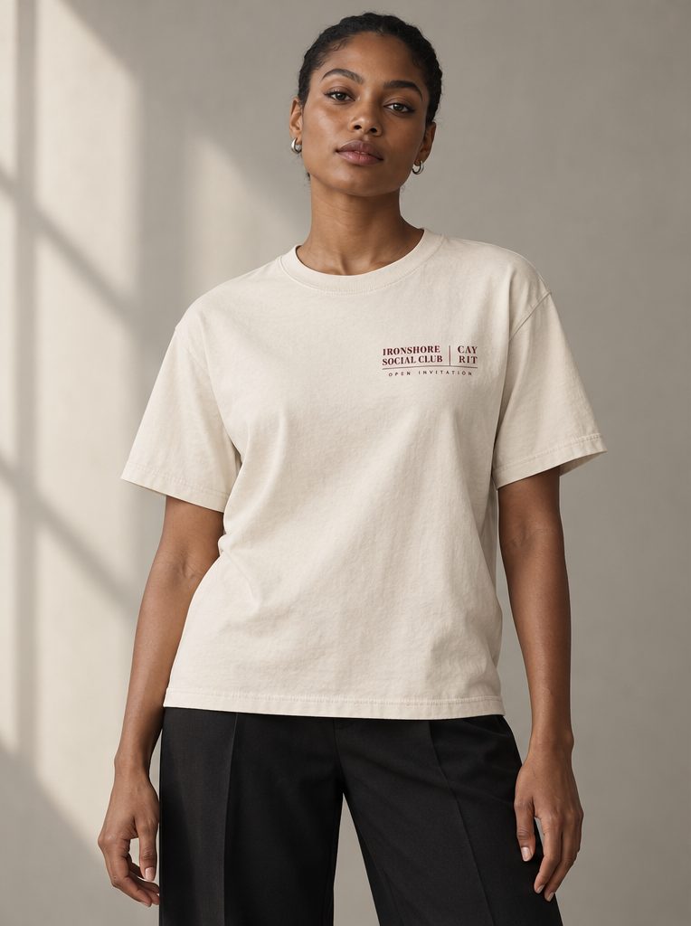 Studio render: a woman in a bone T-shirt with a small crest on the chest.